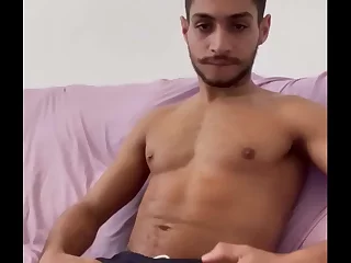 Higer Linz, a smoking hot gay pornstar, fires up his PC for a steamy solo session. This young, hung stud teases with his big dick, jerking off to a satisfying climax in this sizzling gay amateur video.
