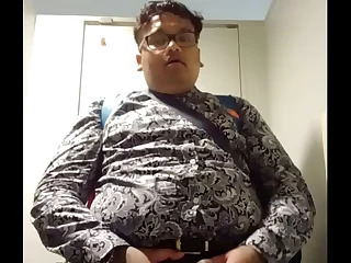 Vaibhav Brij Lal, a chubby Fijian lad, smartly dressed, pleasures himself in a public restroom. His excitement builds, and he shoots a healthy load, then tidies up before leaving.