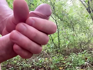 Amateur guy, aroused in the woods, strips down to self-pleasure under the open sky. His masterstroke culminates in a creamy climax, leaving him satisfied and nature's beauty in his wake.